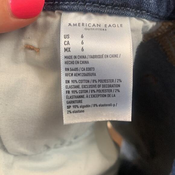 American Eagle Next Level Stretch Curvy Hi-Rise Distressed Shortie Jean Shorts - Picture 4 of 5